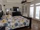 Primary bedroom features hardwood floors, tray ceiling, and direct access to the outside at 3978 Devonshire Dr, Marietta, GA 30066