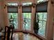 Dining room featuring hardwood floors and large windows overlooking the backyard at 3978 Devonshire Dr, Marietta, GA 30066