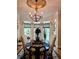 Bright dining room with bay windows, light fixture, and hardwood flooring at 3978 Devonshire Dr, Marietta, GA 30066