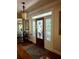 Elegant entryway featuring a stained glass door, hardwood floors, and tasteful décor at 3978 Devonshire Dr, Marietta, GA 30066