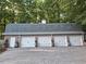 Large four-car garage offers ample parking and storage, with neutral doors and brick facade at 3978 Devonshire Dr, Marietta, GA 30066
