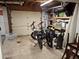 Spacious garage with tiled flooring featuring two electric bikes and storage areas at 3978 Devonshire Dr, Marietta, GA 30066