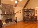 Open living room showcasing stone fireplace, hardwood floors, and decorative bar at 3978 Devonshire Dr, Marietta, GA 30066