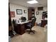 This is a small office featuring a large desk, comfortable rolling chair, and wood laminate flooring at 3978 Devonshire Dr, Marietta, GA 30066