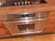 Kitchen showcases stainless steel oven, granite countertops, and custom wood cabinets at 3978 Devonshire Dr, Marietta, GA 30066