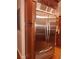Modern kitchen featuring a stainless steel refrigerator with custom wood cabinetry at 3978 Devonshire Dr, Marietta, GA 30066