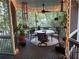 Bright and airy screened porch with ceiling fan, overhead lighting, and comfortable outdoor seating and dining area at 3978 Devonshire Dr, Marietta, GA 30066