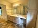 Bathroom features a double sink vanity, large mirror, and a walk-in shower at 53 Villa Rosa Way, Temple, GA 30179