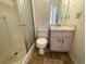 Bathroom with shower stall, toilet, small sink, and tile floor at 53 Villa Rosa Way, Temple, GA 30179