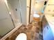 Bathroom includes a walk-in shower, toilet, and tile floors; door to bedroom in view at 53 Villa Rosa Way, Temple, GA 30179
