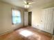 Bedroom with ceiling fan, closet and window for natural light at 53 Villa Rosa Way, Temple, GA 30179