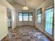 Bright breakfast nook featuring a bay window and a door to the deck at 53 Villa Rosa Way, Temple, GA 30179