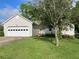 Charming single-Gathering home with two-car garage, lush lawn and tree-lined front yard at 53 Villa Rosa Way, Temple, GA 30179