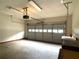 Spacious garage with overhead lighting and storage at 53 Villa Rosa Way, Temple, GA 30179