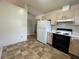 Kitchen view featuring white appliances and linoleum floors at 53 Villa Rosa Way, Temple, GA 30179