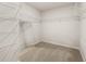 Walk-in closet with installed shelving and carpeted floor at 9452 Pinecrest Path # 314, Jonesboro, GA 30238