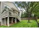 Inviting backyard with a spacious deck, lush lawn, and mature trees creating a private oasis at 1165 Victoria Ne St, Brookhaven, GA 30319