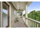 Relaxing covered balcony with seating offers a peaceful outdoor space at 1165 Victoria Ne St, Brookhaven, GA 30319