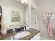 Elegant bathroom features a granite countertop, stylish vanity, and a bright window view at 1165 Victoria Ne St, Brookhaven, GA 30319