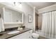 Clean bathroom features granite counters, modern fixtures, and a shower-tub combination at 1165 Victoria Ne St, Brookhaven, GA 30319
