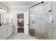 Modern bathroom with glass shower, double vanity, and separate soaking tub at 1165 Victoria Ne St, Brookhaven, GA 30319