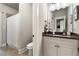 Bathroom showcases a granite countertop, single sink vanity, and tiled shower at 1165 Victoria Ne St, Brookhaven, GA 30319