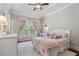 Cheerful bedroom features a bright window, plush carpet, and a comfortable bed at 1165 Victoria Ne St, Brookhaven, GA 30319