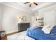 Well-lit bedroom boasts a tray ceiling, hardwood floors, and ample dresser storage at 1165 Victoria Ne St, Brookhaven, GA 30319