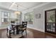 Inviting dining area with natural light, modern chandelier, and hardwood flooring at 1165 Victoria Ne St, Brookhaven, GA 30319