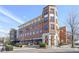 A red brick apartment building with outdoor dining and patios at 1165 Victoria Ne St, Brookhaven, GA 30319