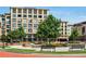 Exterior of a modern mixed use building with well manicured landscaping, benches and a fountain at 1165 Victoria Ne St, Brookhaven, GA 30319