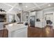Well-lit kitchen with stainless steel appliances and a spacious island open to other living areas at 1165 Victoria Ne St, Brookhaven, GA 30319