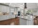 Open kitchen with stainless steel appliances, a large island, and lots of cabinet storage at 1165 Victoria Ne St, Brookhaven, GA 30319