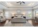 This bedroom offers great light, tray ceiling, ceiling fan and plush area rug at 1165 Victoria Ne St, Brookhaven, GA 30319