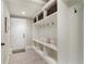 Bright mudroom featuring built-in shelving, hooks, and a bench for added convenience at 1165 Victoria Ne St, Brookhaven, GA 30319