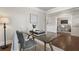 Comfortable office featuring a modern glass desk, hardwood floors, and neutral paint at 1165 Victoria Ne St, Brookhaven, GA 30319