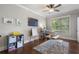 Inviting playroom featuring hardwood floors, a ceiling fan, and plenty of natural light at 1165 Victoria Ne St, Brookhaven, GA 30319