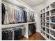 Custom walk-in closet with ample storage, shelving, and hardwood floors at 1165 Victoria Ne St, Brookhaven, GA 30319