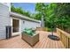 This back deck features two cushioned lounge chairs, a table, and an umbrella at 1349 Middlesex Ne Ave, Atlanta, GA 30306