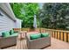 This back deck features two cushioned lounge chairs, a table, and an umbrella at 1349 Middlesex Ne Ave, Atlanta, GA 30306