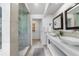 Stylish bathroom featuring double sinks, a glass-enclosed shower, and sleek fixtures at 1349 Middlesex Ne Ave, Atlanta, GA 30306
