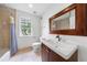 Bathroom featuring a vanity with a dark wood cabinet and large mirror at 1349 Middlesex Ne Ave, Atlanta, GA 30306