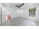 This bedroom features a ceiling fan, grey carpet, natural light from the window, and plenty of closet space at 1349 Middlesex Ne Ave, Atlanta, GA 30306