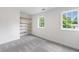 A bright bedroom with built-in shelves and two large windows at 1349 Middlesex Ne Ave, Atlanta, GA 30306