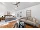 Bright bedroom with a vaulted ceiling, hardwood floors, and a cozy seating area at 1349 Middlesex Ne Ave, Atlanta, GA 30306