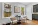 Breakfast nook with hardwood floors, modern light fixture and oversized window at 1349 Middlesex Ne Ave, Atlanta, GA 30306