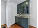 Elegant built-in cabinet with glass doors, granite countertop, drawers, and subway tile backsplash at 1349 Middlesex Ne Ave, Atlanta, GA 30306