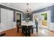 Bright dining room featuring a modern chandelier, table with seating, and glass doors leading to an outdoor deck at 1349 Middlesex Ne Ave, Atlanta, GA 30306