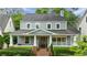 Charming two-story home featuring a welcoming front porch with classic columns and brick accents at 1349 Middlesex Ne Ave, Atlanta, GA 30306