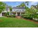 Charming two-story home featuring a well-manicured lawn and inviting front porch, creating a welcoming curb appeal at 1349 Middlesex Ne Ave, Atlanta, GA 30306